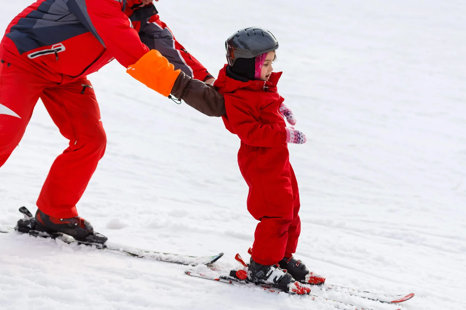 What are the benefits of skiing with young children?